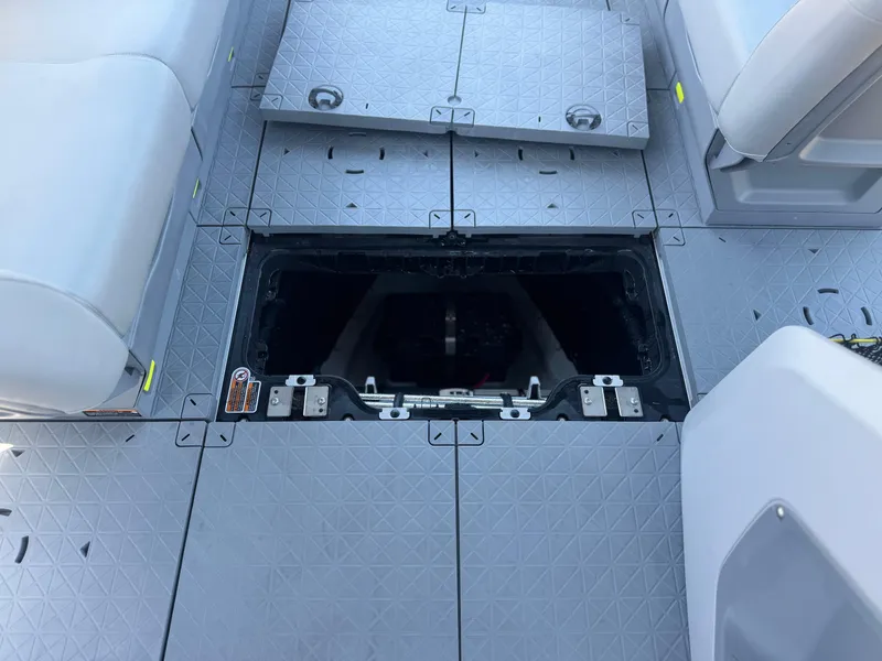 Slide: The Image of 2023 Sea-Doo Switch Cruise 21 deck with open storage compartment, showcasing modular seating. - 25