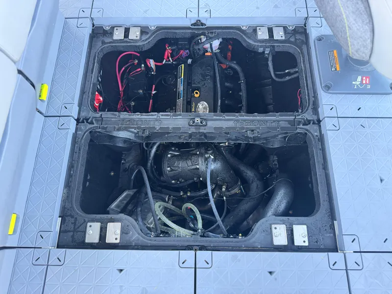 Slide: The Image of 2023 Sea-Doo Switch Cruise 21 engine compartment with visible wiring and components. - 26