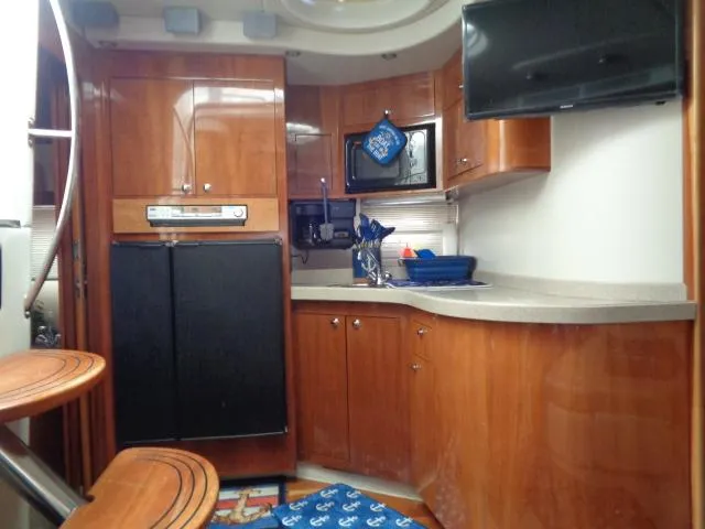 Slide: The Image of Luxurious 2003 Regal Commodore 3860 yacht interior with modern kitchen amenities. - 22