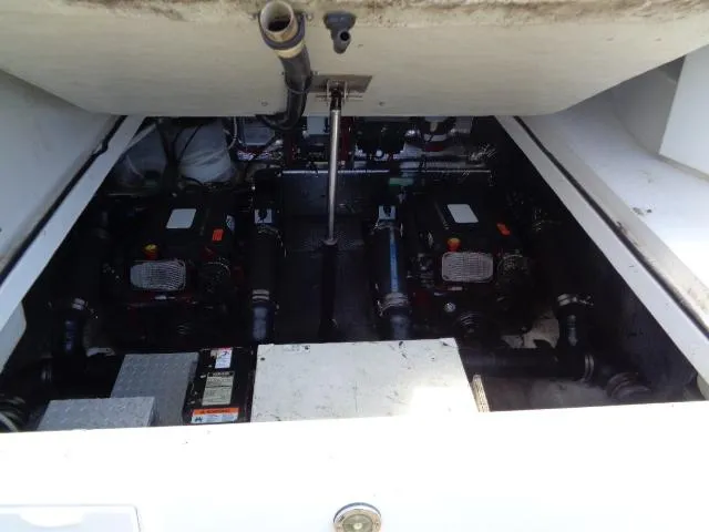 Slide: The Image of Engine compartment of 2003 Regal Commodore 3860 boat, showing dual engines and mechanical components. - 37