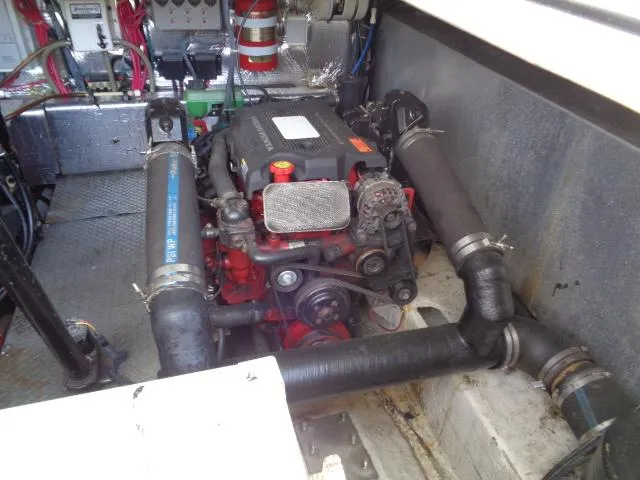 Slide: The Image of Engine compartment of a 2003 Regal Commodore 3860 boat, showcasing mechanical components. - 40