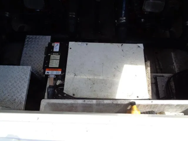 Slide: The Image of Engine compartment of a 2003 Regal Commodore 3860 boat, showing mechanical components. - 41