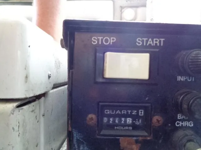 Slide: The Image of Control panel with stop/start switch and hour meter on a 2003 Regal Commodore 3860. - 42