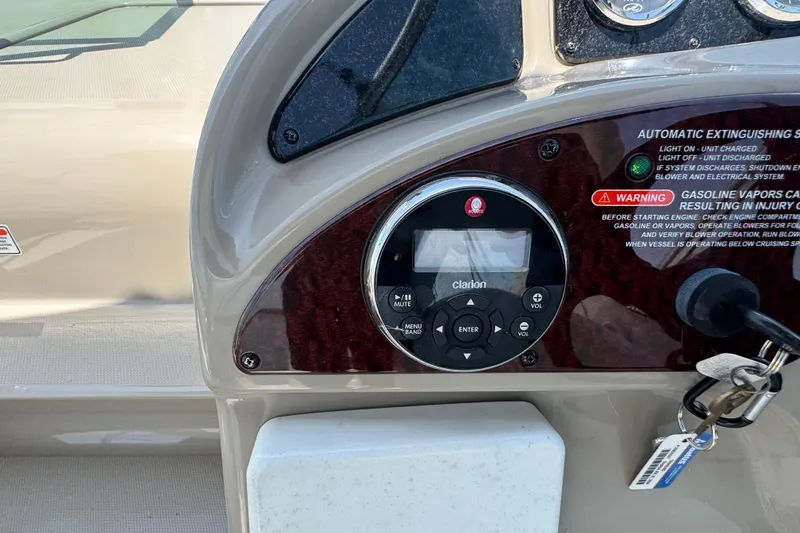 Slide: The Image of Control panel of a 2006 Sea Ray 260 Sundancer boat with Clarion audio system. - 15