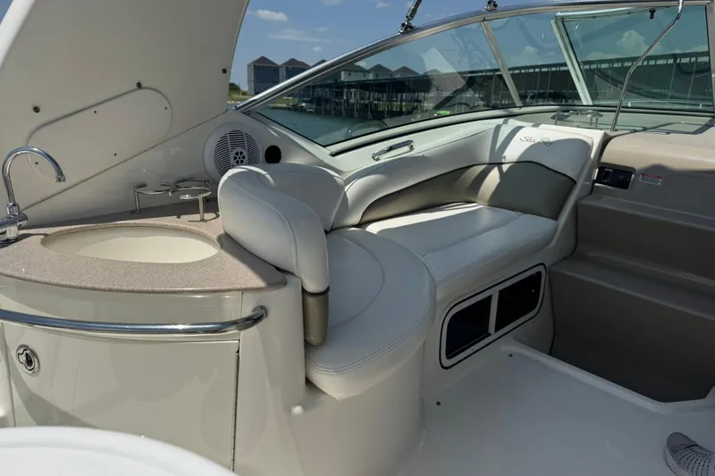 Slide: The Image of Interior of 2006 Sea Ray 260 Sundancer boat with seating and sink area. - 21