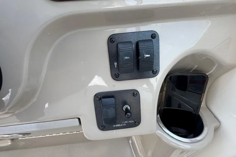 Slide: The Image of Control panel on a 2006 Sea Ray 260 Sundancer boat dashboard. - 24