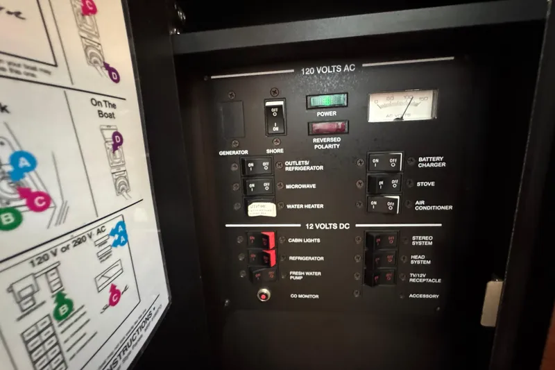 Slide: The Image of Electrical control panel on a 2006 Sea Ray 260 Sundancer boat. - 33