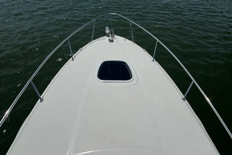 Slide: The Image of Bow view of 2006 Sea Ray 260 Sundancer on water. - 35