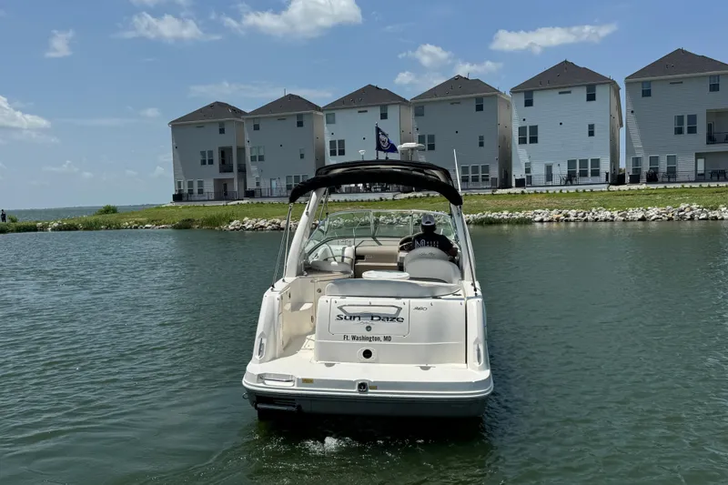 Slide: The Image of Sea Ray 260 Sundancer 2006 boat on water near waterfront homes, sunny day. - 7