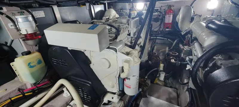 Slide: The Image of Engine room of a 2003 Sea Ray 390 Motor Yacht, showcasing mechanical components and wiring. - 17