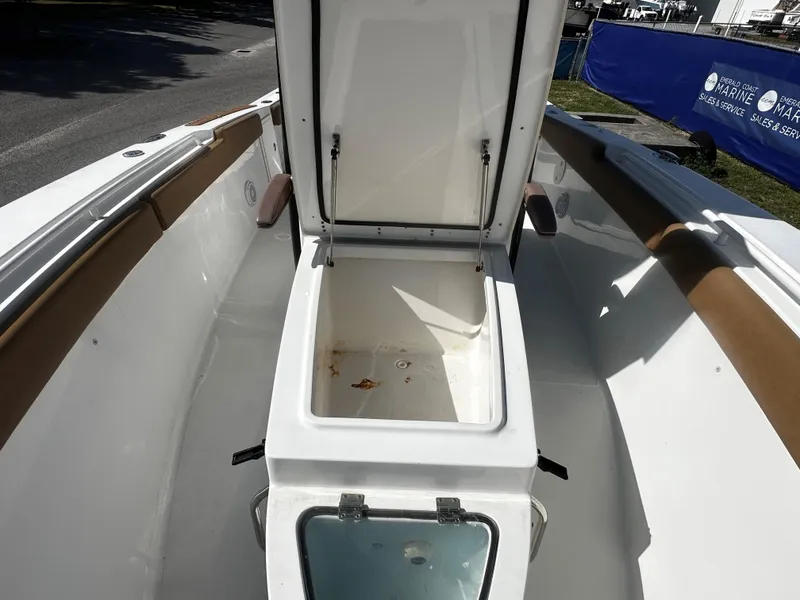 Slide: The Image of 2020 Sea Hunt Gamefish 27 Coffin Box open on deck, showcasing storage space. - 12