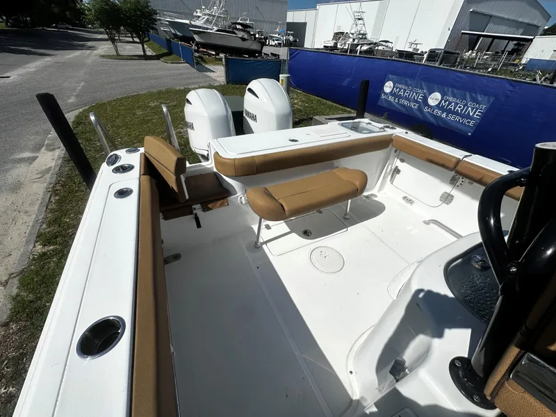 Slide: The Image of 2020 Sea Hunt Gamefish 27 Coffin Box boat interior with seating and dual Yamaha engines. - 6