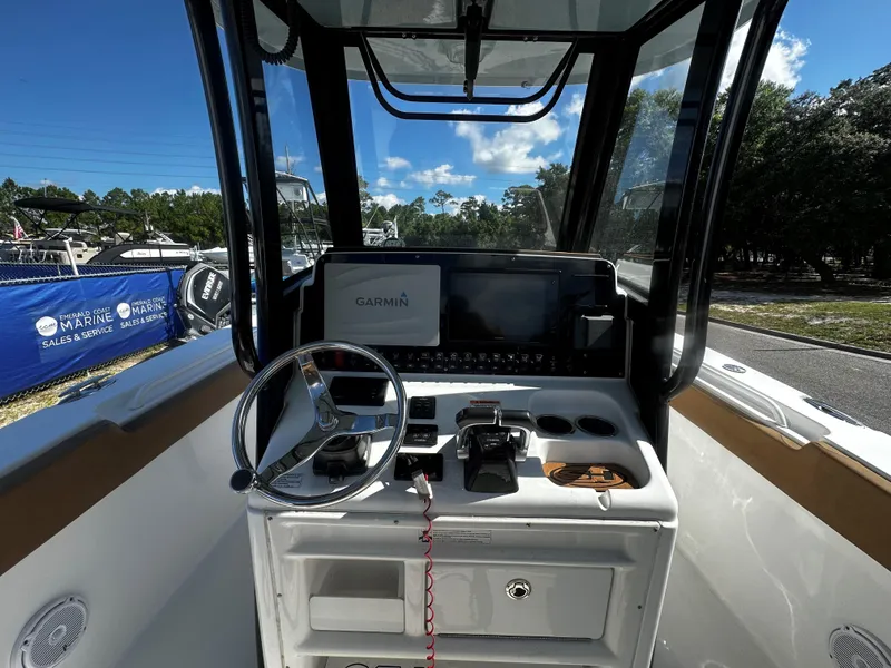 Slide: The Image of 2020 Sea Hunt Gamefish 27 Coffin Box boat dashboard with Garmin navigation system. - 7