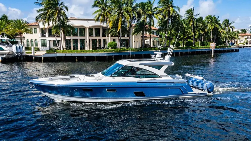 Slide: The Image of 2019 Formula 430 All Sport Crossover yacht cruising near waterfront mansion and palm trees. - 3