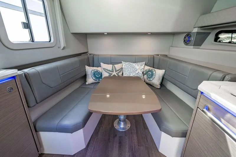 Slide: The Image of 2019 Formula 430 All Sport Crossover interior with gray seating and decorative pillows. - 33