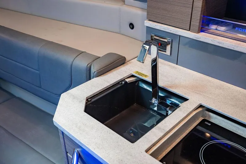 Slide: The Image of 2019 Formula 430 All Sport Crossover interior with modern sink and seating area. - 38