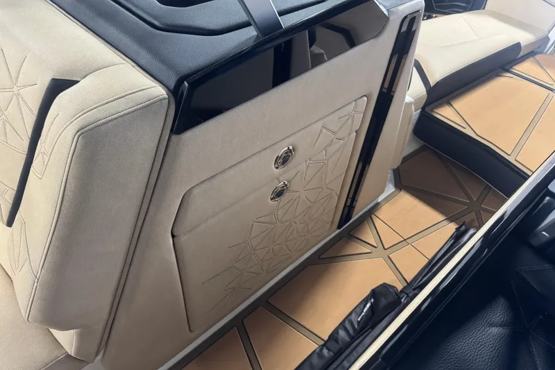 Slide: The Image of 2026 Nautique Super Air Nautique G25 Paragon interior with beige upholstery and geometric design. - 13