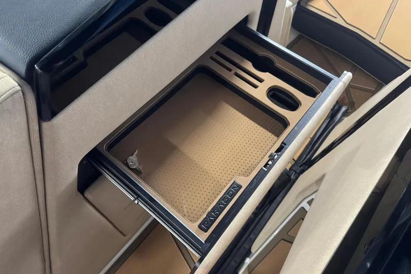 Slide: The Image of Interior storage compartment of 2026 Nautique Super Air Nautique G25 Paragon boat. - 14