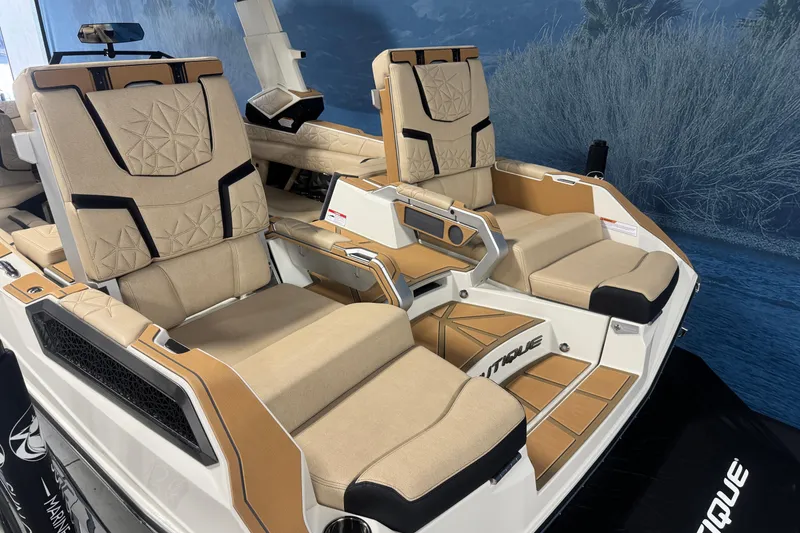 Slide: The Image of Luxurious seating on 2026 Nautique Super Air Nautique G25 Paragon boat, featuring beige upholstery. - 5