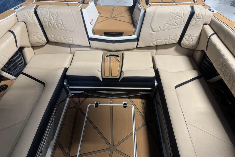 Slide: The Image of Luxurious interior of 2026 Nautique Super Air Nautique G25 Paragon boat with beige seating. - 8