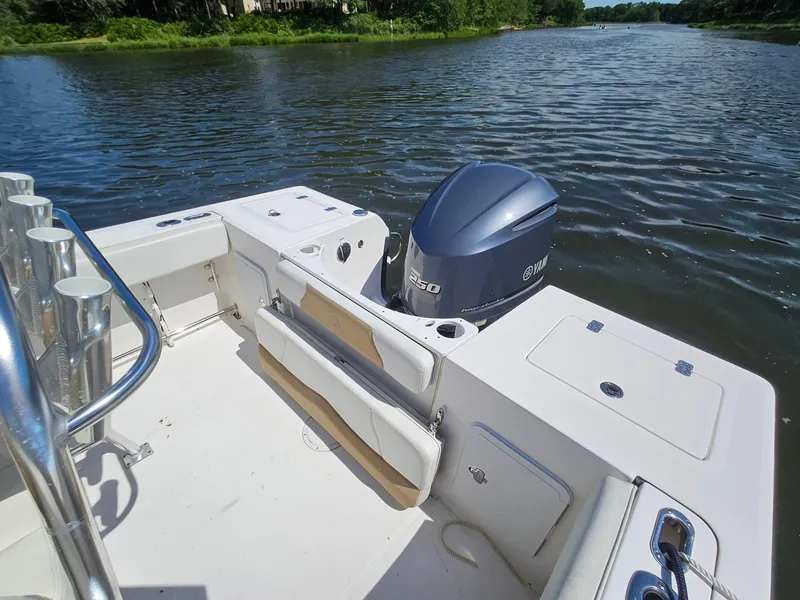 Slide: The Image of Edgewater 228CC 2016 boat with Yamaha 250 engine on a calm river. - 20