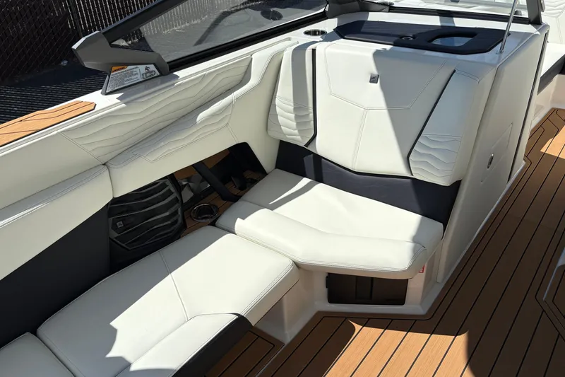 Slide: The Image of Luxurious interior seating of 2026 Nautique Super Air Nautique G25 boat. - 13