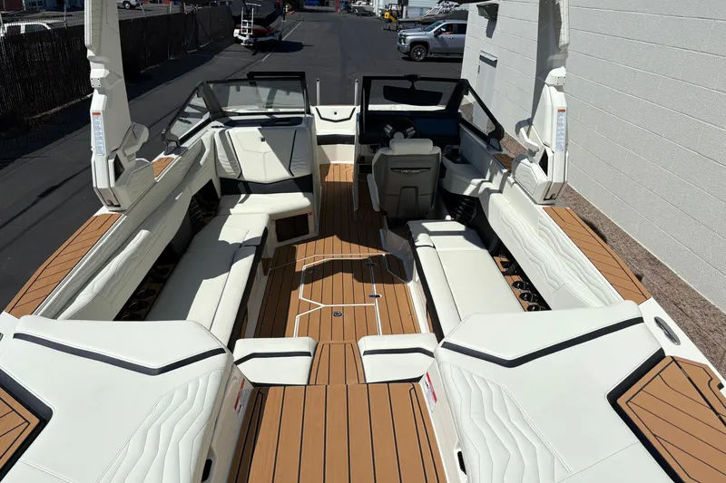 Slide: The Image of 2026 Nautique Super Air Nautique G25 boat interior with luxurious seating and modern design. - 9
