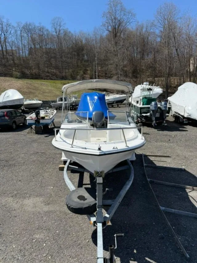 Slide: The Image of 2001 Edgewater 185DC boat on trailer in outdoor storage area. - 6