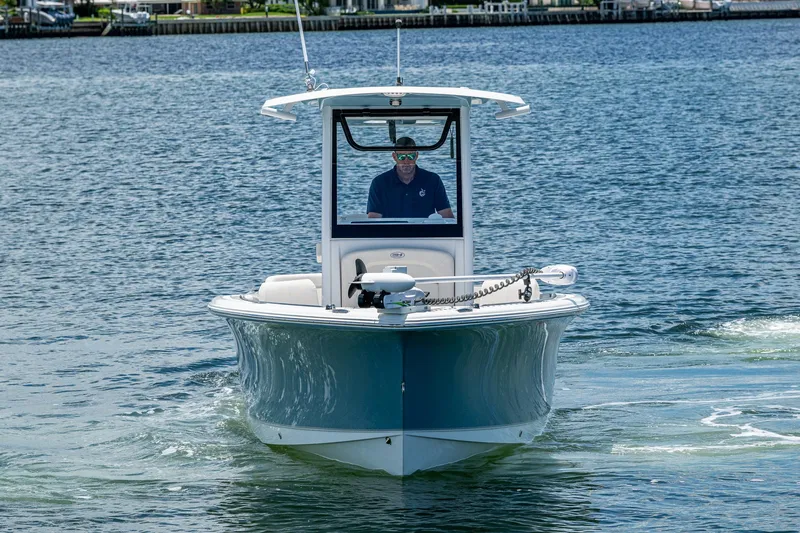 Slide: The Image of 2024 Sea Hunt Ultra 239 SE boat cruising on calm water. - 35