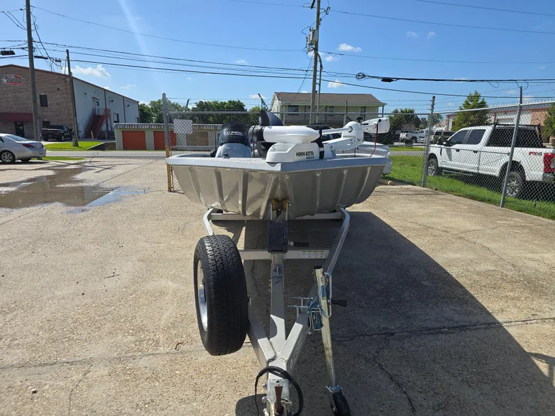 Slide: The Image of 2014 Xpress XP200 boat on trailer in parking lot, sunny day. - 4