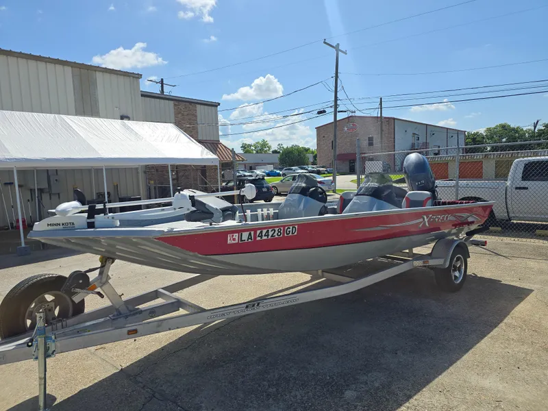 Slide: The Image of 2014 Xpress XP200 boat on trailer, parked outdoors under clear sky. - 5