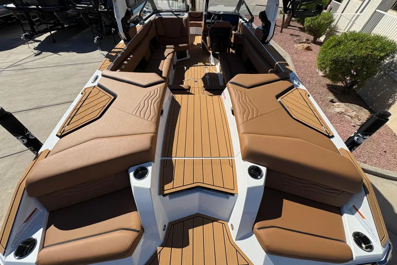 Slide: The Image of 2026 Nautique Super Air Nautique G25 interior with tan seating and sleek design. - 6