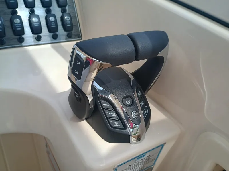 Slide: The Image of Throttle control panel on 2025 Grady-White Freedom 275 boat, featuring modern design and functionality. - 17