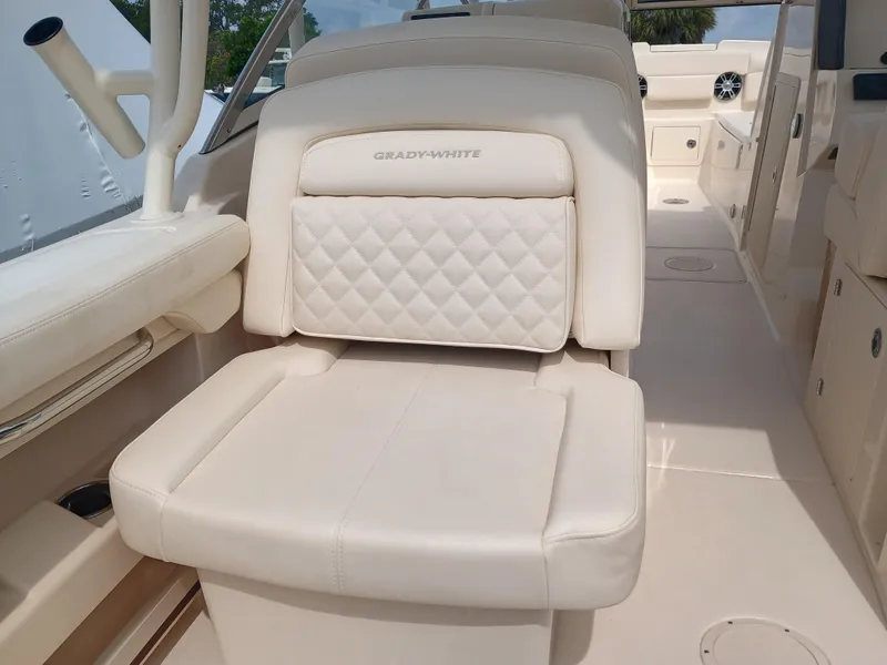 Slide: The Image of 2025 Grady-White Freedom 275 boat interior with luxurious white seating. - 22