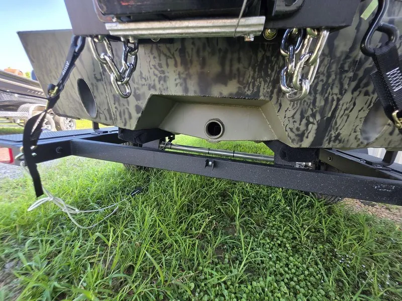 Slide: The Image of 2026 Tracker Grizzly® 1650 T Prairie Wings Edition boat on trailer, showing underside details. - 14