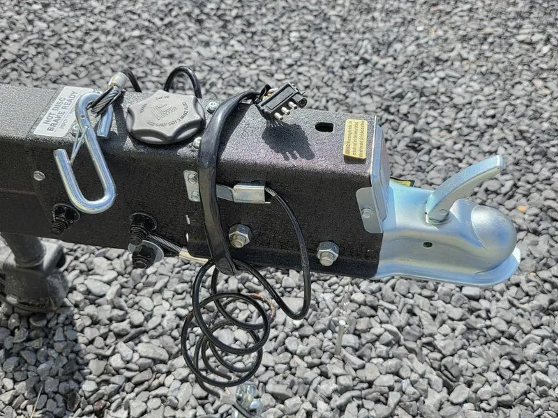 Slide: The Image of Trailer hitch of 2026 Tracker Grizzly® 1650 T Prairie Wings Edition on gravel surface. - 15