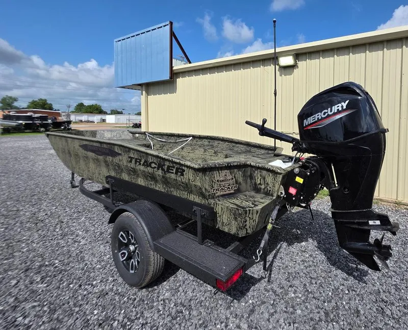 Slide: The Image of 2026 Tracker Grizzly® 1650 T Prairie Wings Edition boat with Mercury engine on trailer. - 3