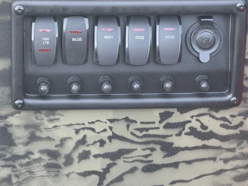 Slide: The Image of Control panel of 2026 Tracker Grizzly® 1650 T Prairie Wings Edition boat. - 7