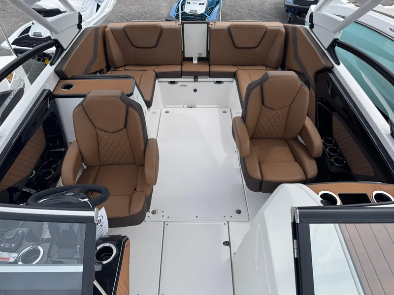 Slide: The Image of 2025 Yamaha Boats 252SD interior with luxurious brown seating and modern design. - 15