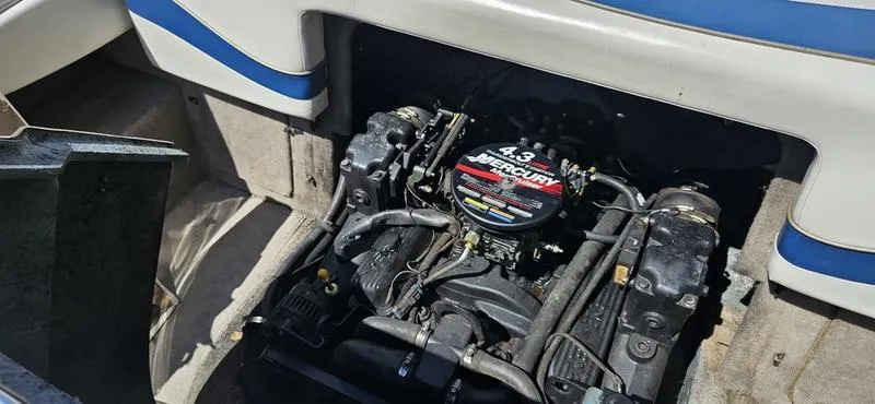 Slide: The Image of Engine compartment of a 2002 Bayliner 212 Capri Cuddy with a 4.3L Mercury engine. - 10