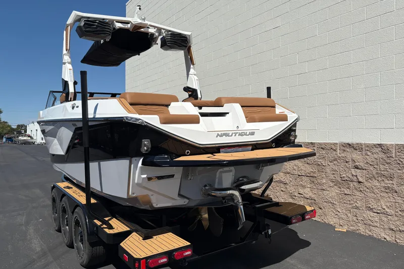 Slide: The Image of 2026 Nautique Super Air Nautique G23 boat on trailer, parked outdoors. - 7