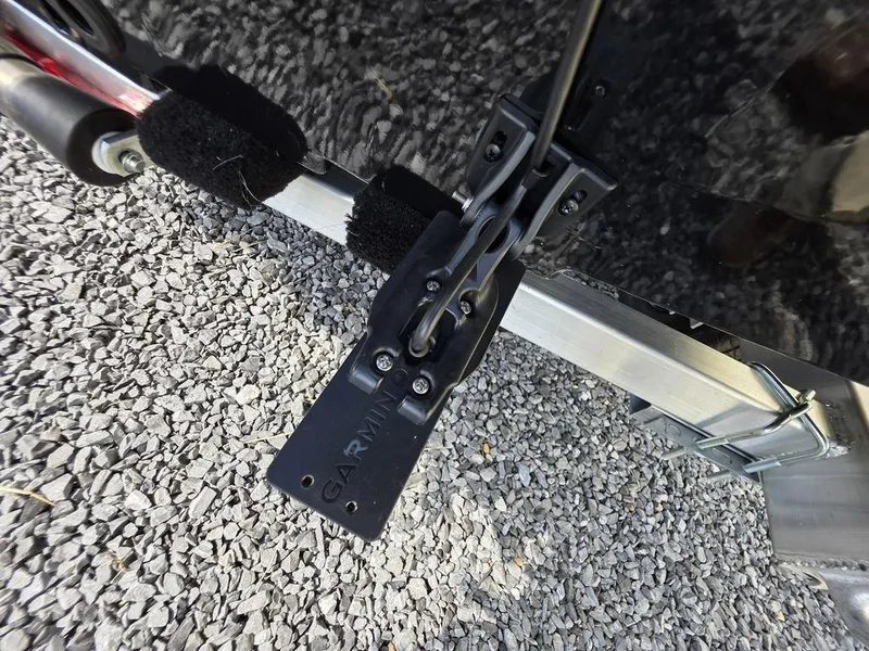 Slide: The Image of Boat trailer with Garmin mount on Xpress H20C, 2026 model, on gravel surface. - 11