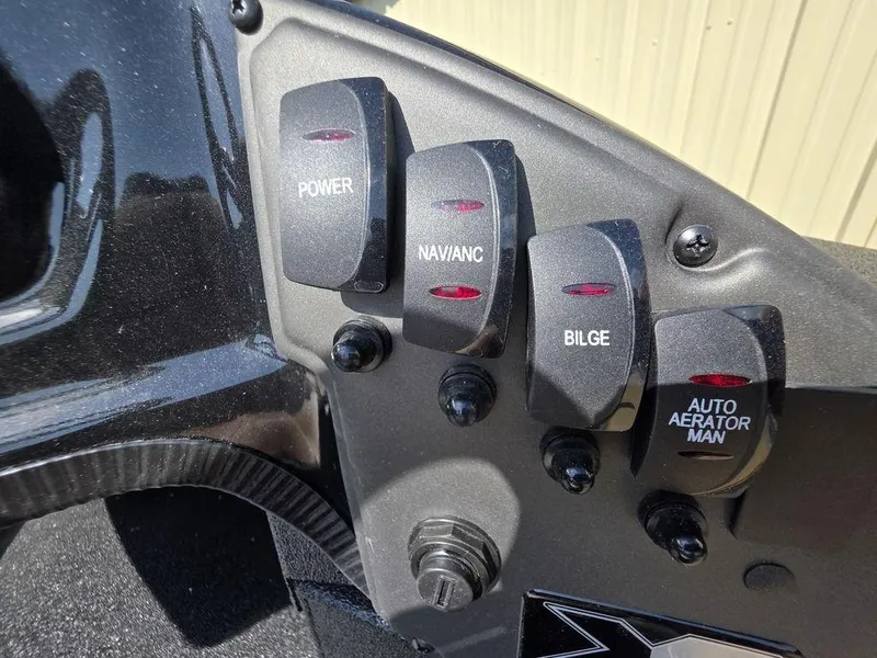 Slide: The Image of Control panel of 2026 Xpress H20C boat with labeled switches for power, navigation, bilge, and aerator. - 7