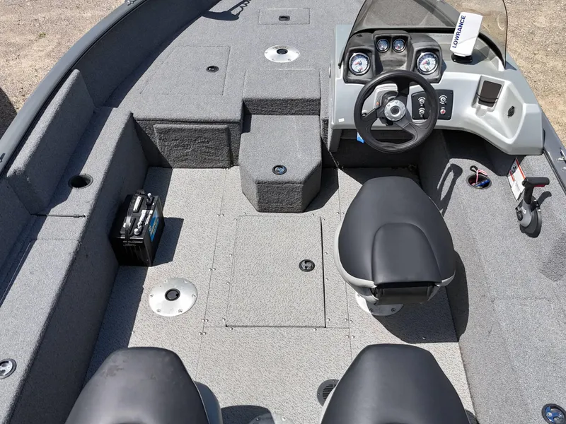 Slide: The Image of 2018 Tracker Pro Guide V-175 SC boat with outboard motor on trailer, parked outdoors. - 7