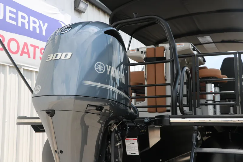 Slide: The Image of 2026 Sylvan G3 DLZ Bar boat with Yamaha 300 engine, displayed at a dealership. - 11