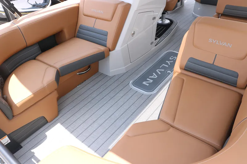 Slide: The Image of Luxurious interior of 2026 Sylvan G3 DLZ Bar boat with tan and gray seating. - 16