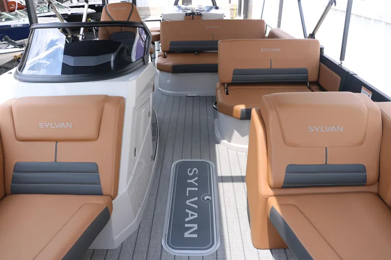 Slide: The Image of Luxurious interior of 2026 Sylvan G3 DLZ Bar pontoon boat with tan seating. - 17