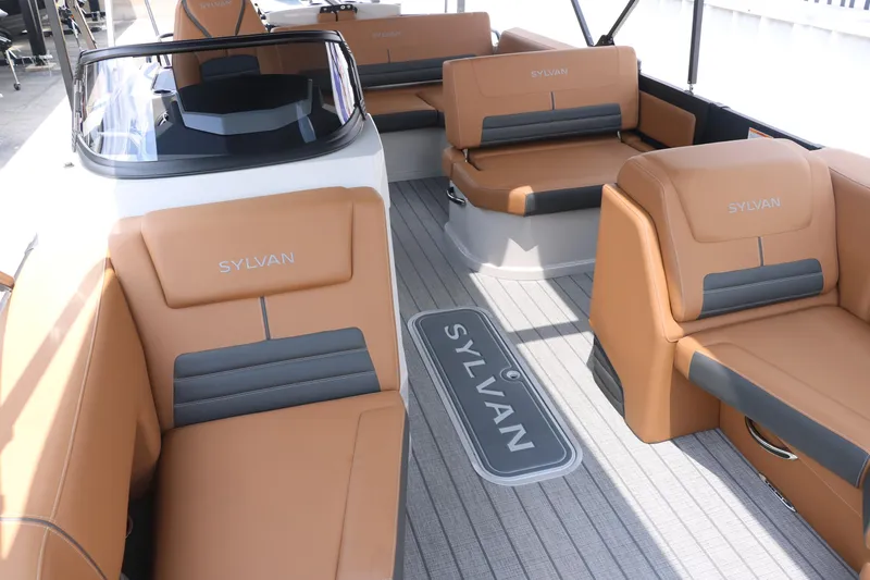 Slide: The Image of 2026 Sylvan G3 DLZ Bar boat interior with tan seating and sleek design. - 18