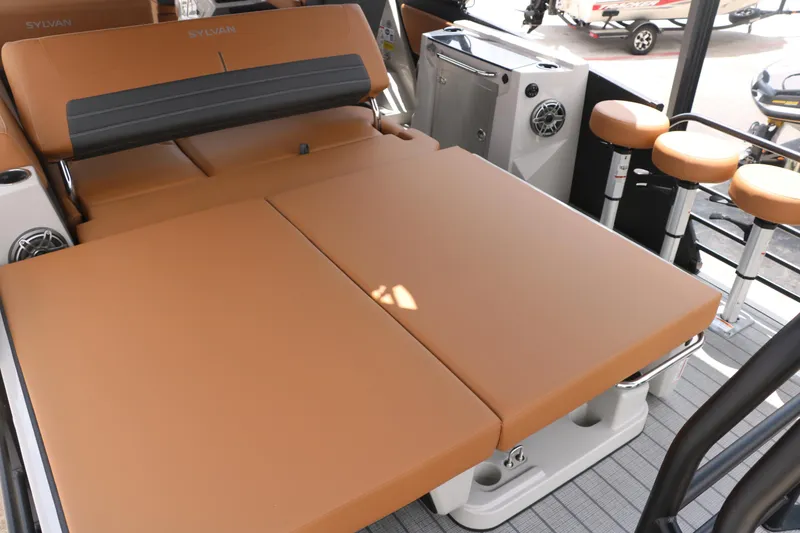 Slide: The Image of 2026 Sylvan G3 DLZ Bar boat interior with tan seating and bar stools. - 22