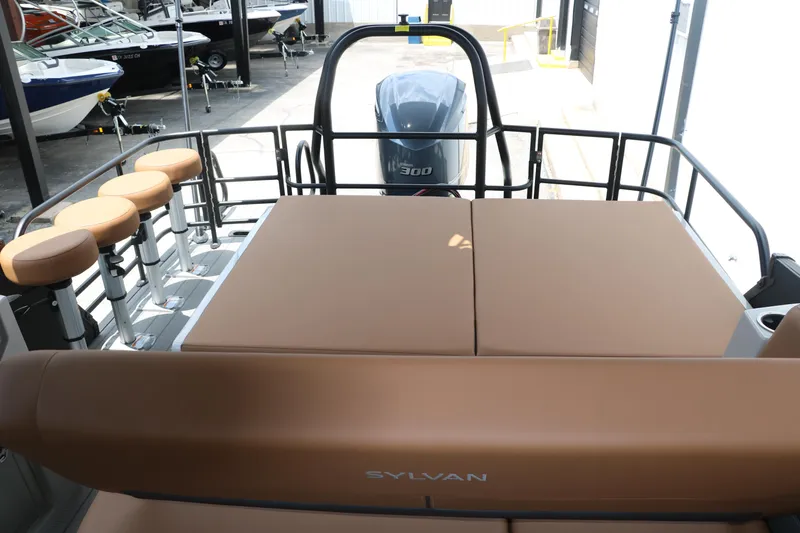 Slide: The Image of 2026 Sylvan G3 DLZ Bar boat with tan seating and Yamaha motor. - 24